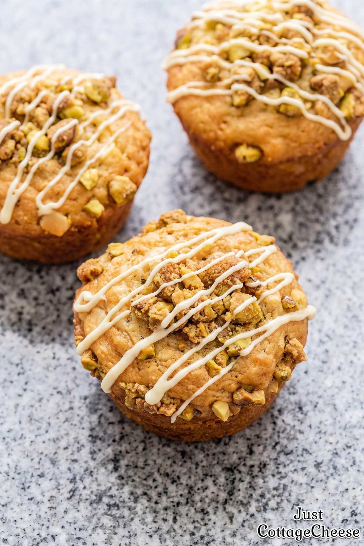 Soft pistachio crunch muffins on a plate