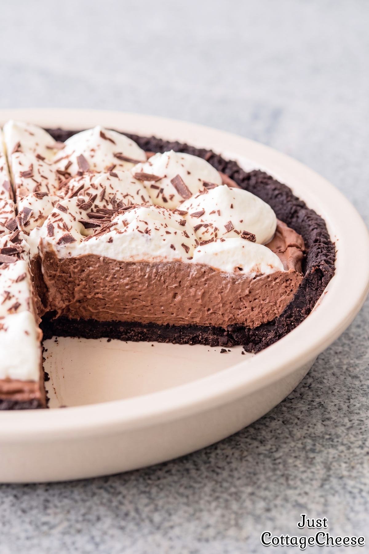 Decadent protein chocolate cream pie slice.