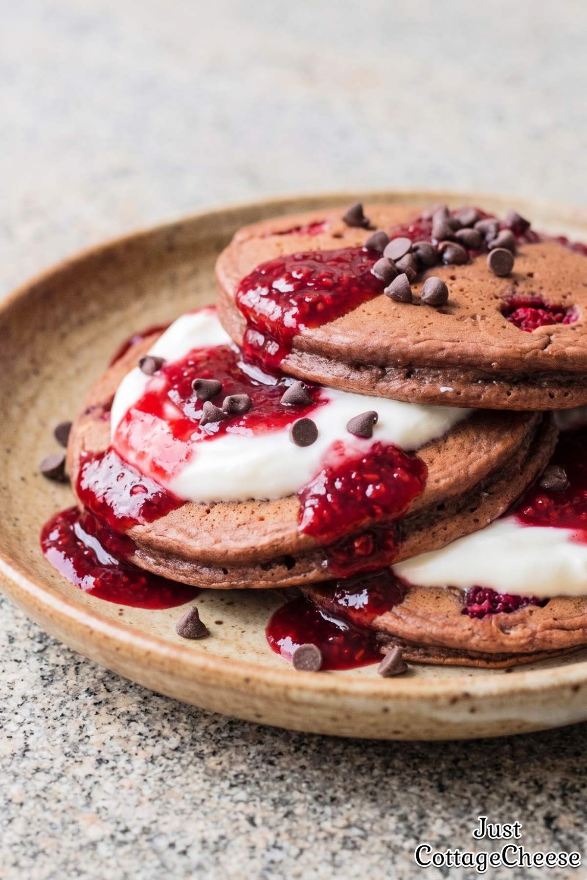 Fresh raspberry chocolate protein pancake stack