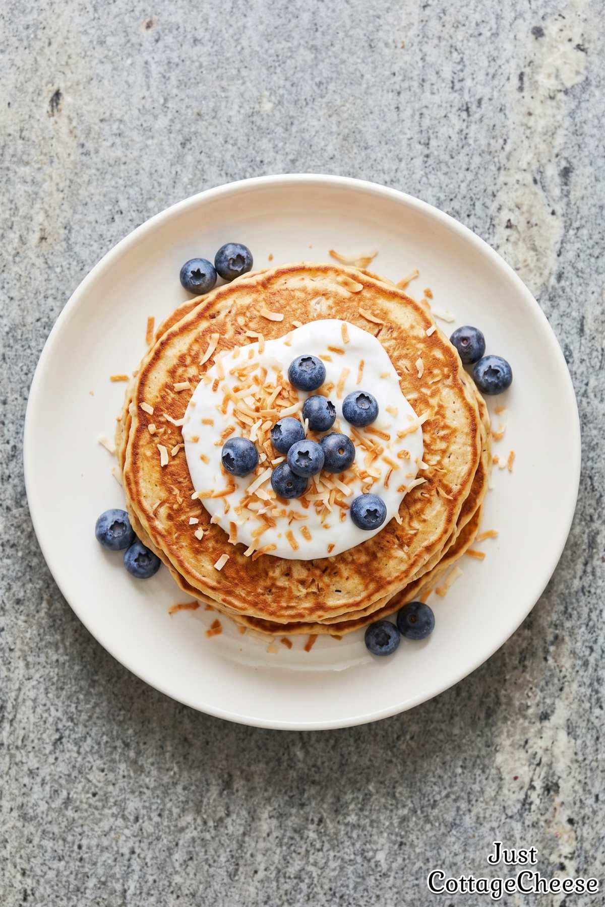 Stack of fluffy cottage cheese coconut pancakes