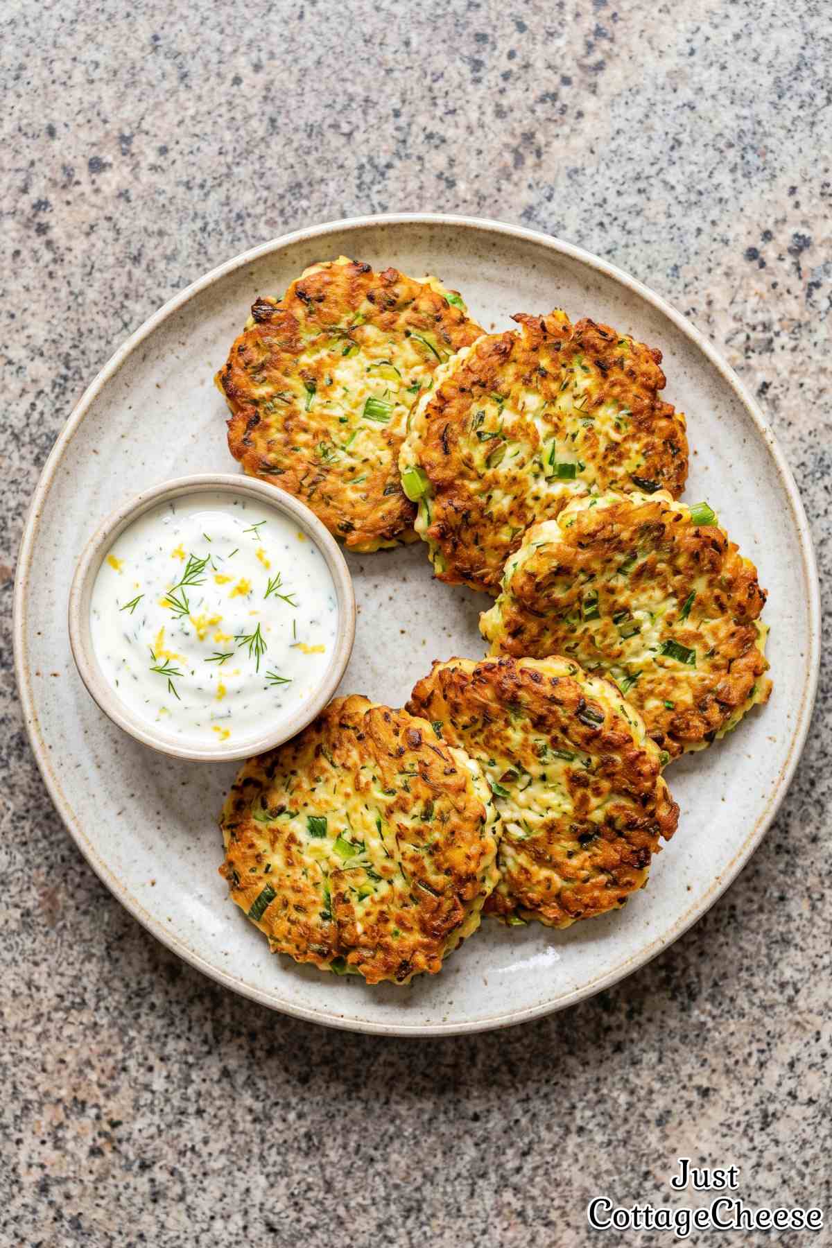 Golden protein zucchini fritters on a plate