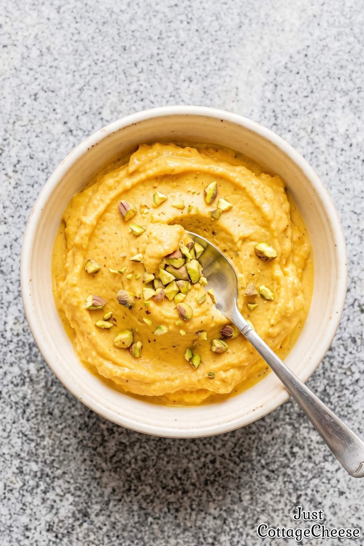 Blended mango protein ice cream scoop