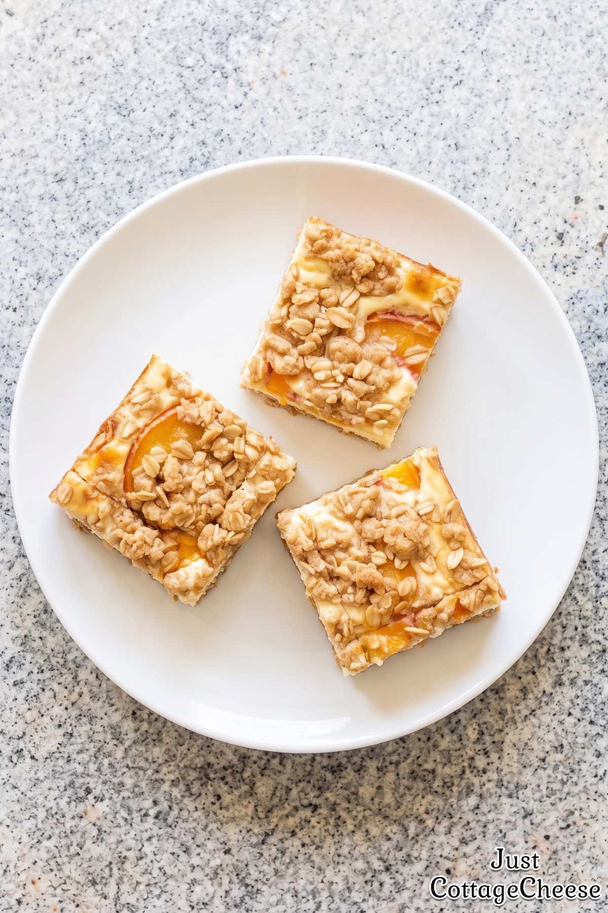 Golden baked peach cobbler cheesecake bars