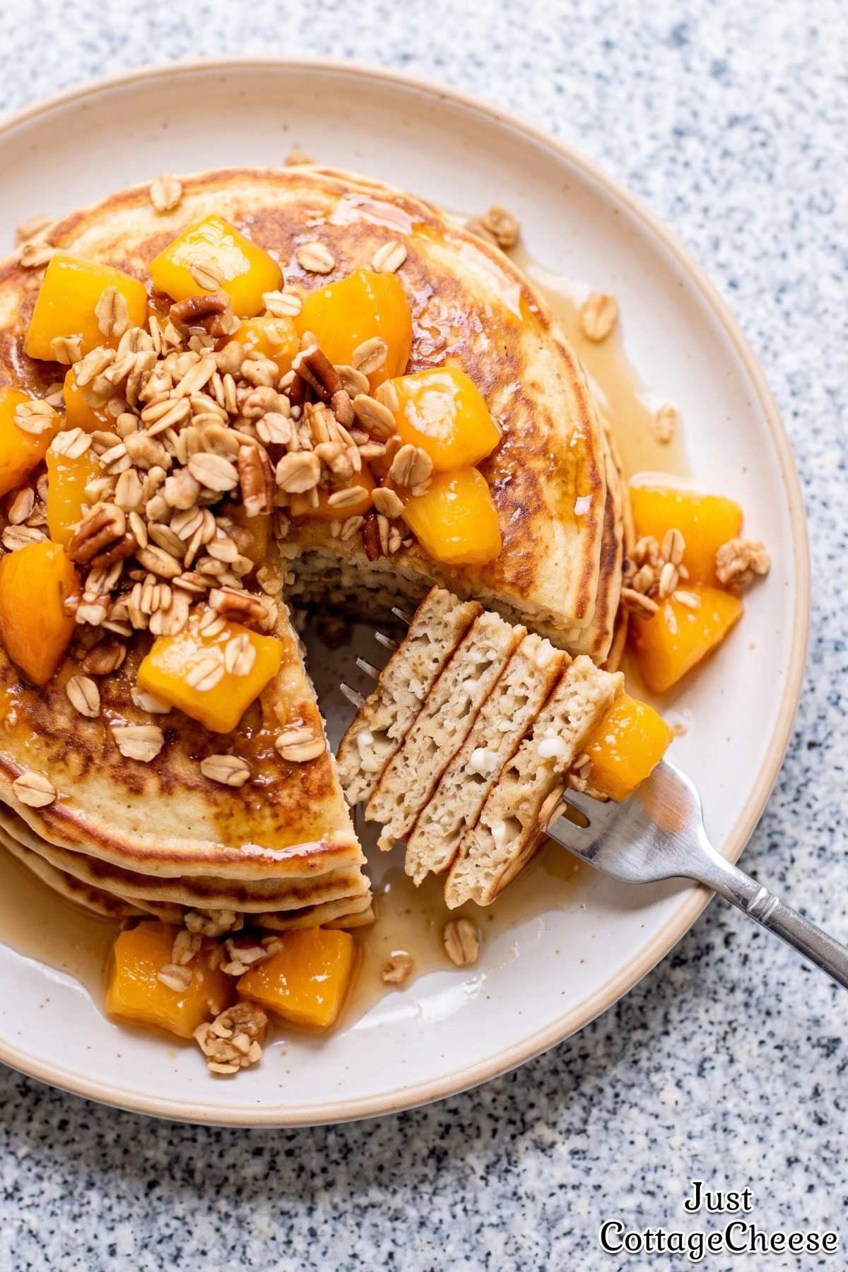 Fluffy cottage cheese pancakes with peaches