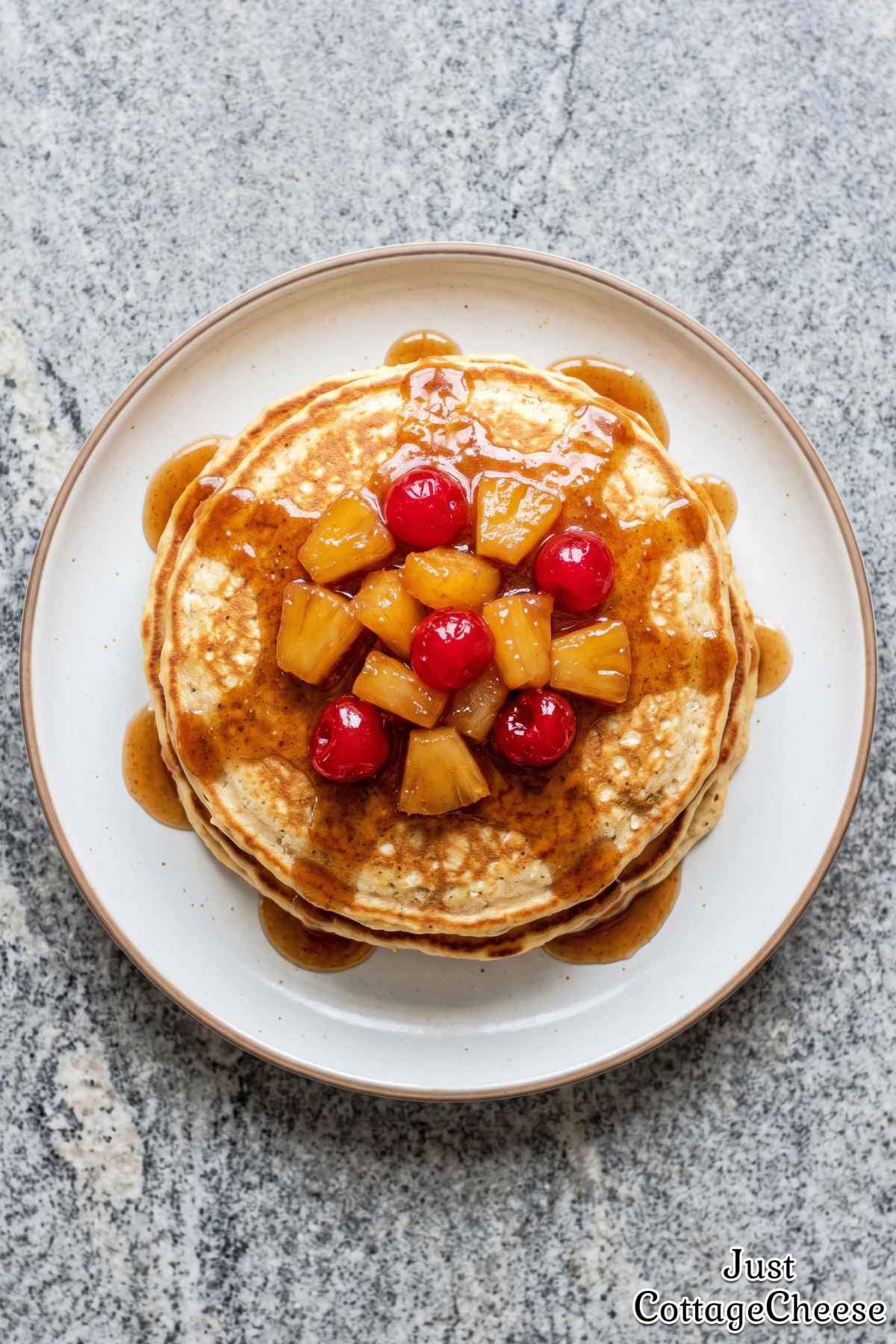 Cottage cheese pancakes topped with pineapple