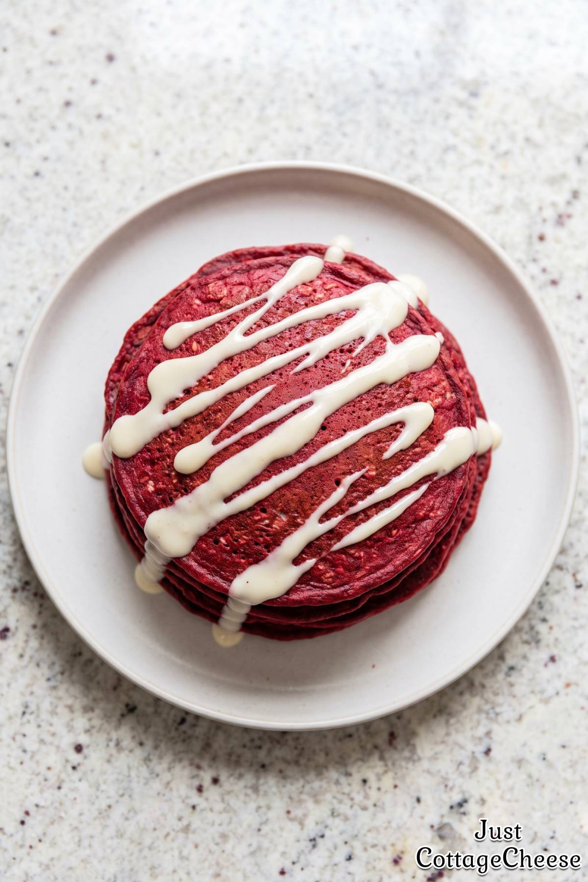 Red velvet pancakes with cream topping