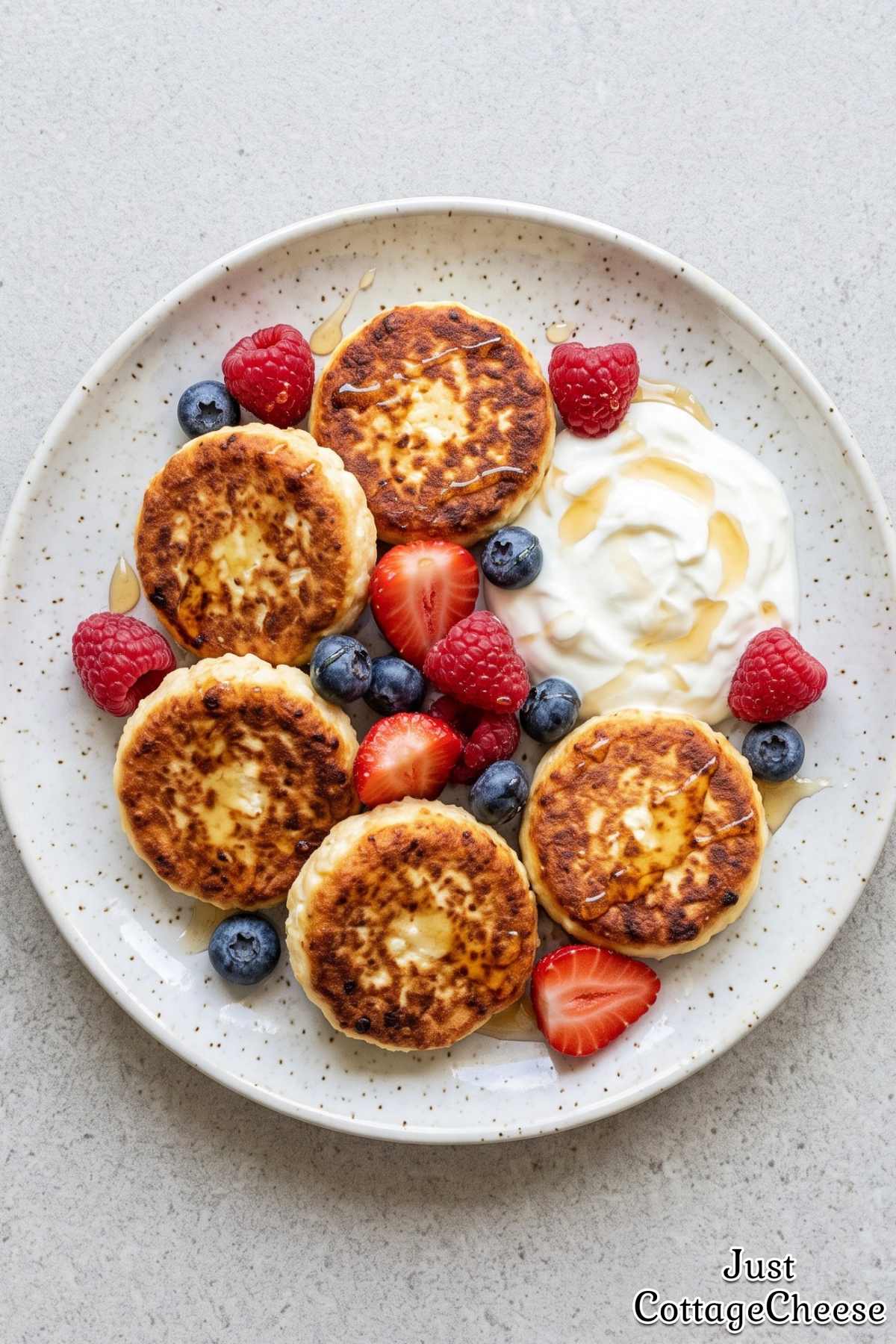 Homemade cottage cheese syrniki and berries