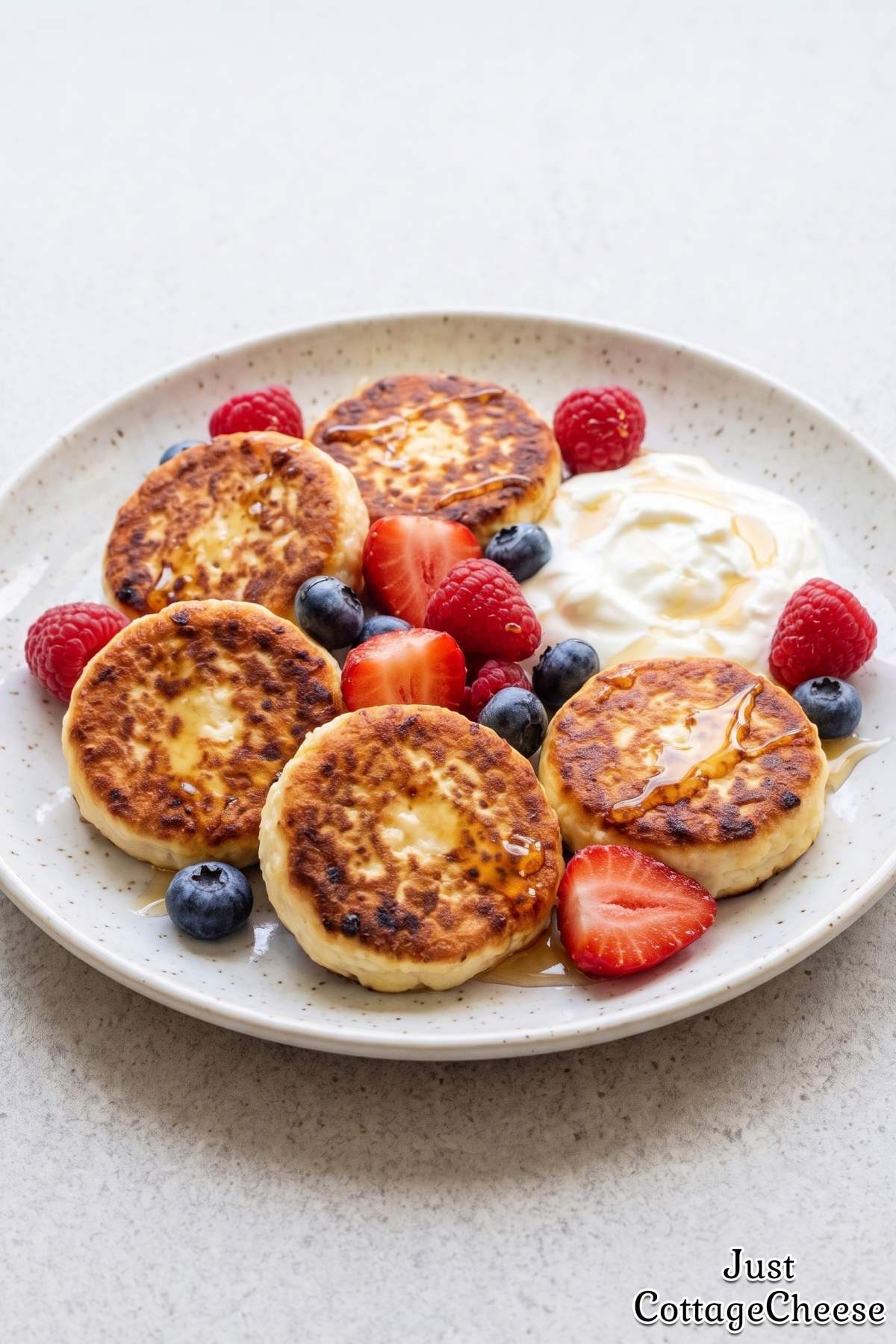 Cottage cheese protein syrniki with fresh berries